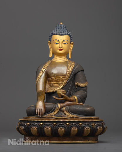 Front view of Shakyamuni Buddha Statue with gold-gilded face and oxidized copper body