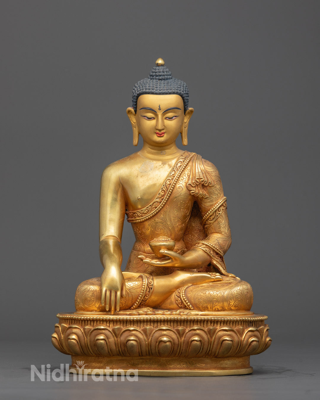 Front view of Shakyamuni Buddha Tibetan statue with 24K gold-gilded face and lotus throne