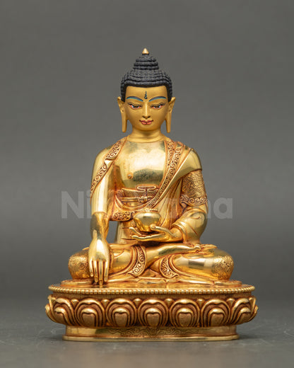 Front view of Shakyamuni Buddha statue, gold fire-gilded copper, seated on lotus