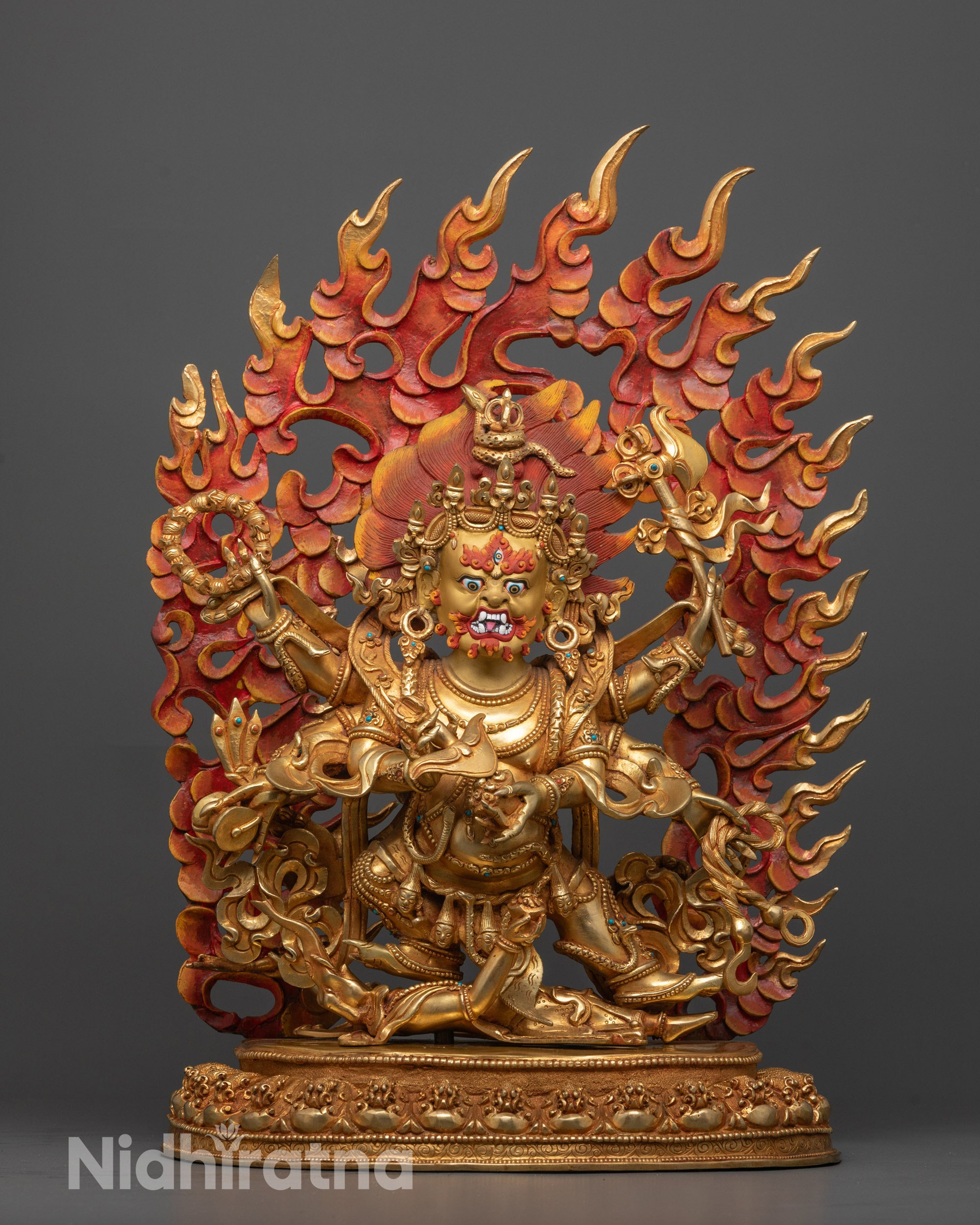 Front view of Six Armed Mahakala statue hand-carved in Nepal, seated on lotus base
