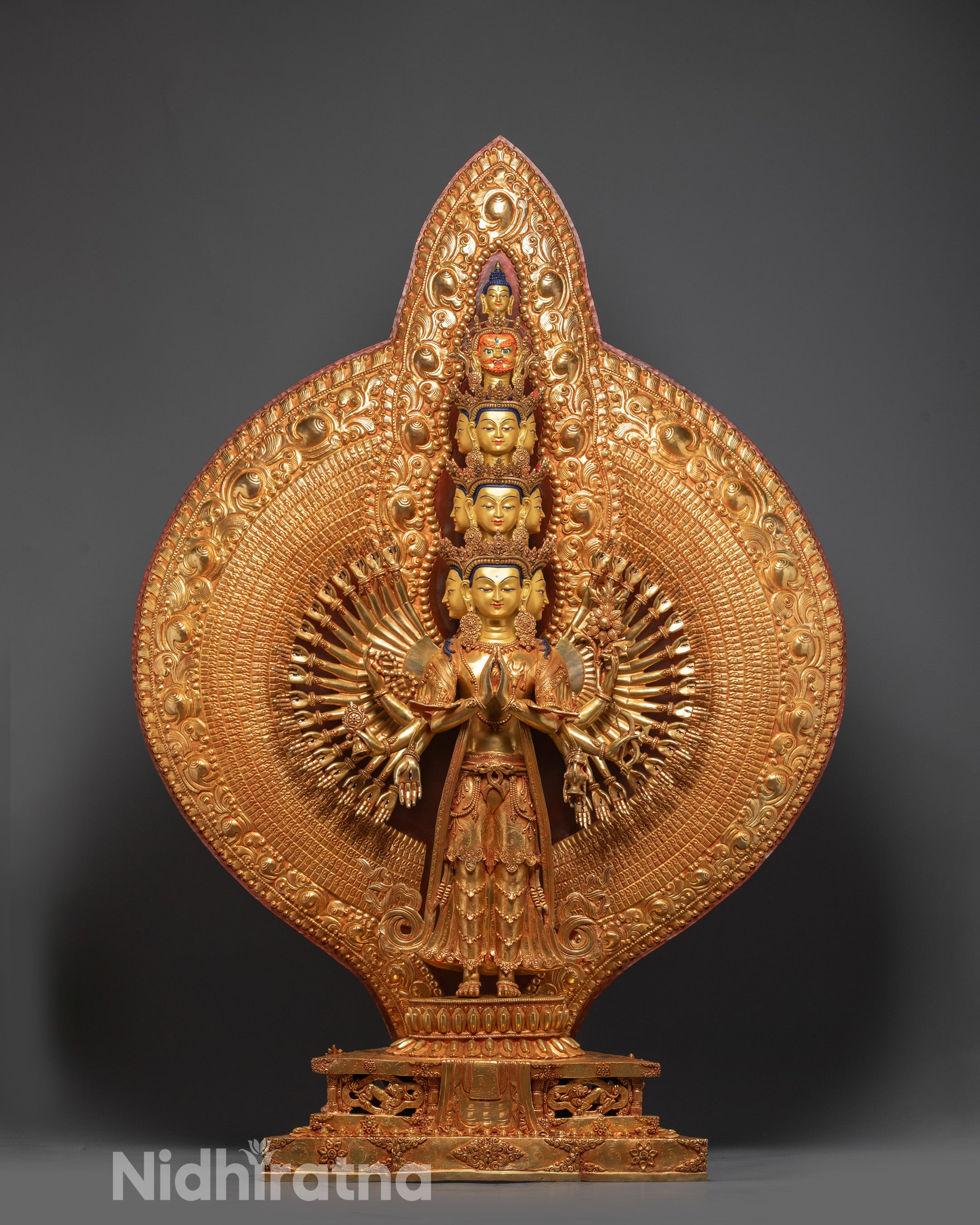 Front view of Thousand-Arm Avalokiteshvara statue with 24K gold-gilded face and copper body