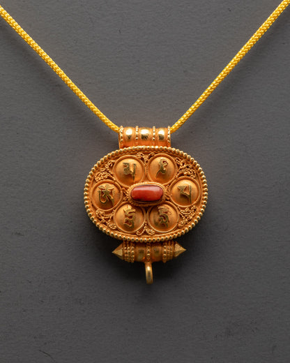 Front view of Tibetan Ghau Prayer Box with gold filigree and coral stones
