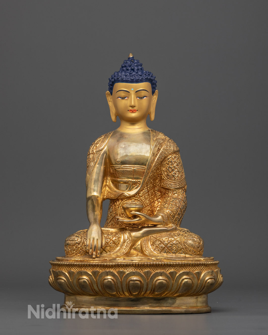 Front view of Tibetan Namo Shakyamuni Buddha Sculpture with gold-gilded face and carvings