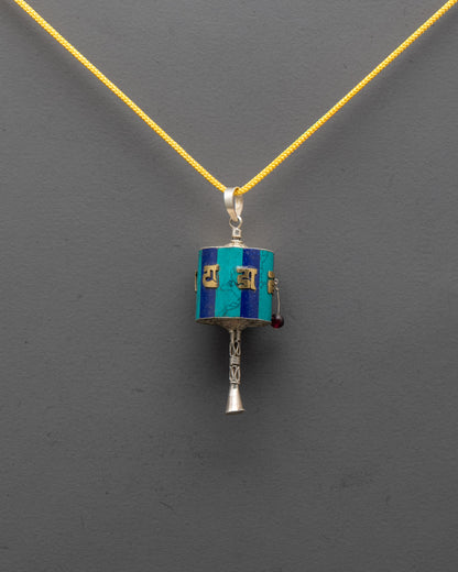 Front view of Tibetan Prayer Wheel Locket with gold-plated mantra on pure silver body
