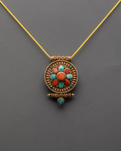Front view of Tibetan Protection Pendant with gold plating and vibrant turquoise and coral stones
