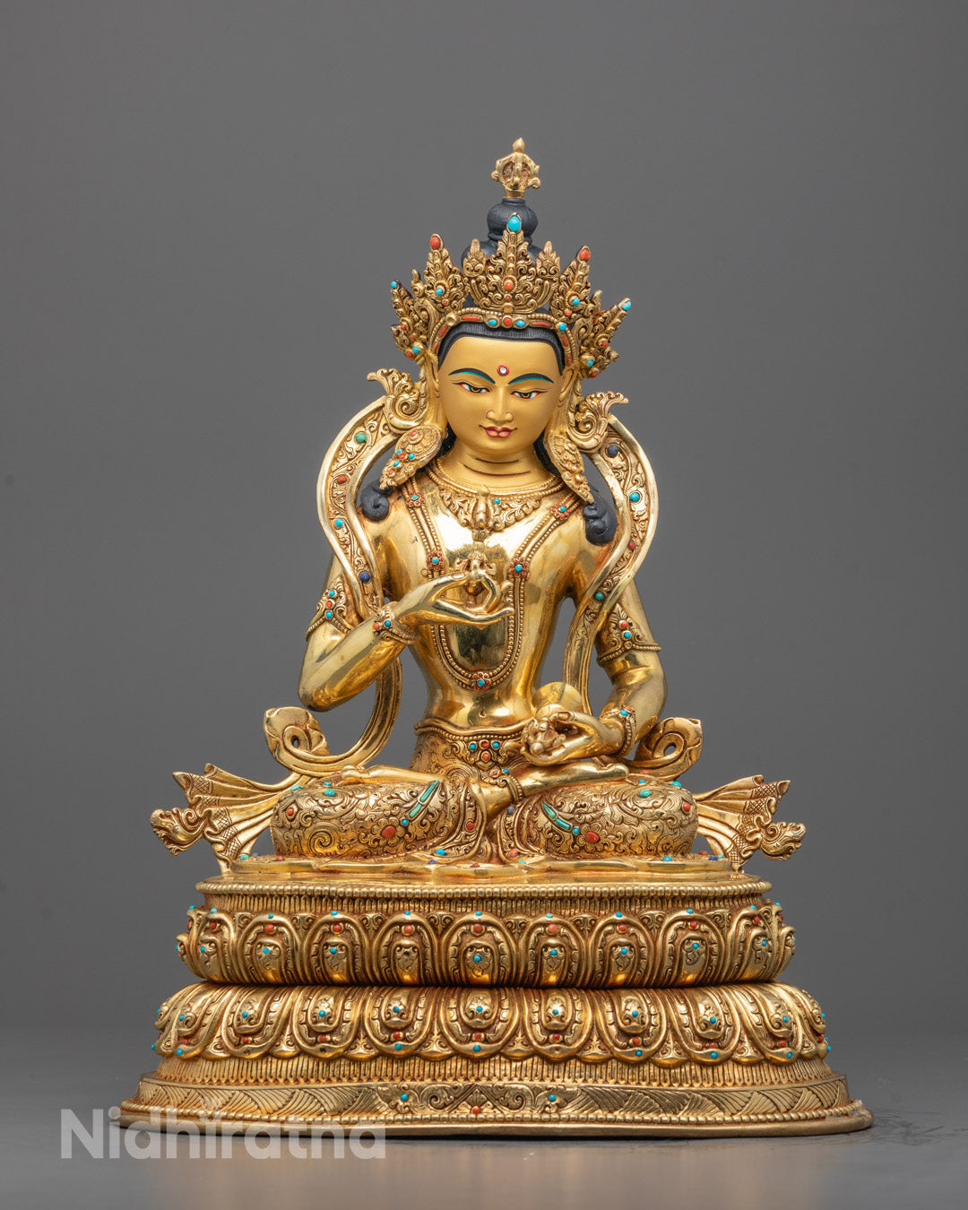 Front view of Tibetan Vajrasattva statue with 24K gold face and lotus throne