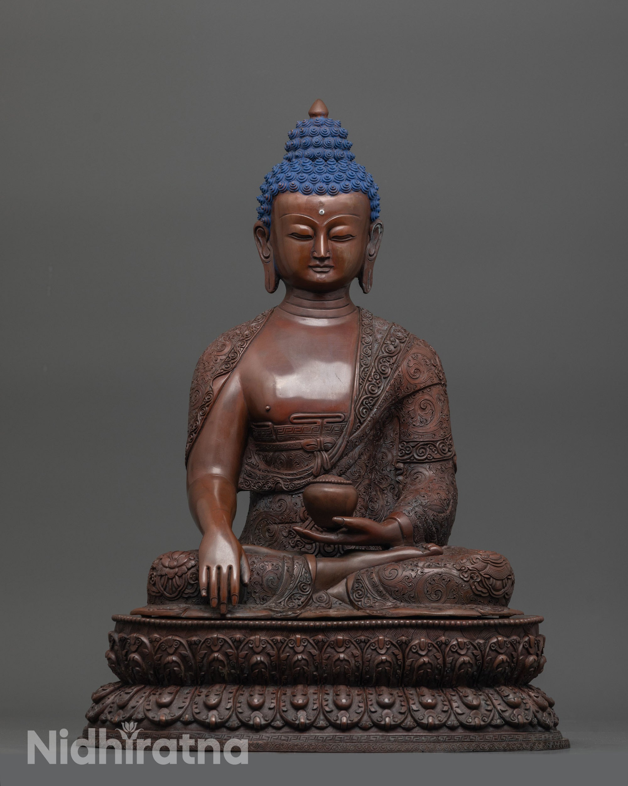 Front view of Timeless Shakyamuni Buddha Statue with alms bowl and intricate robe details