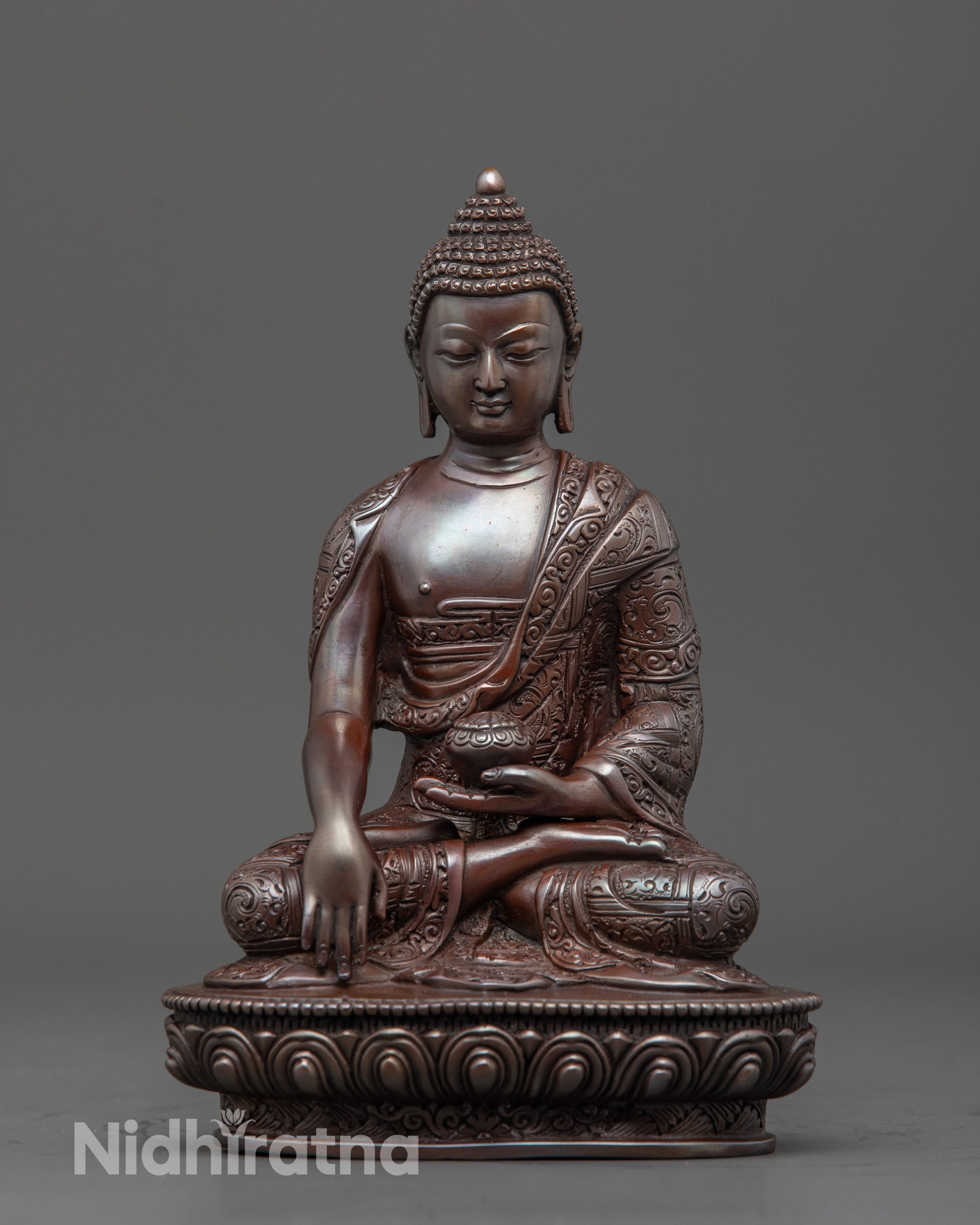 Front view of Traditional Gautama Shakyamuni Buddha Statue with lotus throne and alms bowl