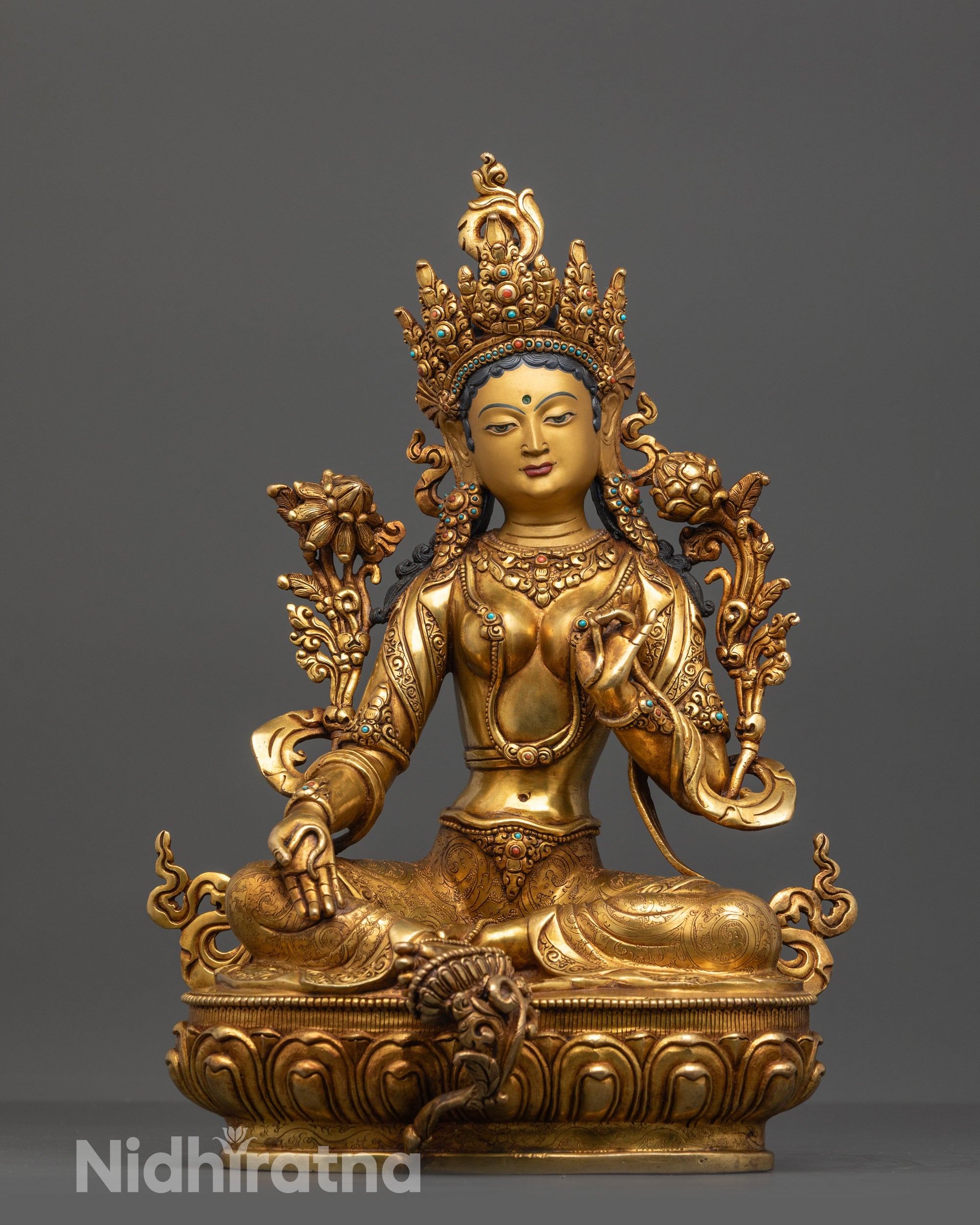 Front view of Tranquil Green Tara Statue with gold-gilded face and flowing robe