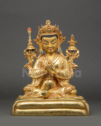 Front view of Trisong Detsen Statue holding dharma wheel and utpala flowers