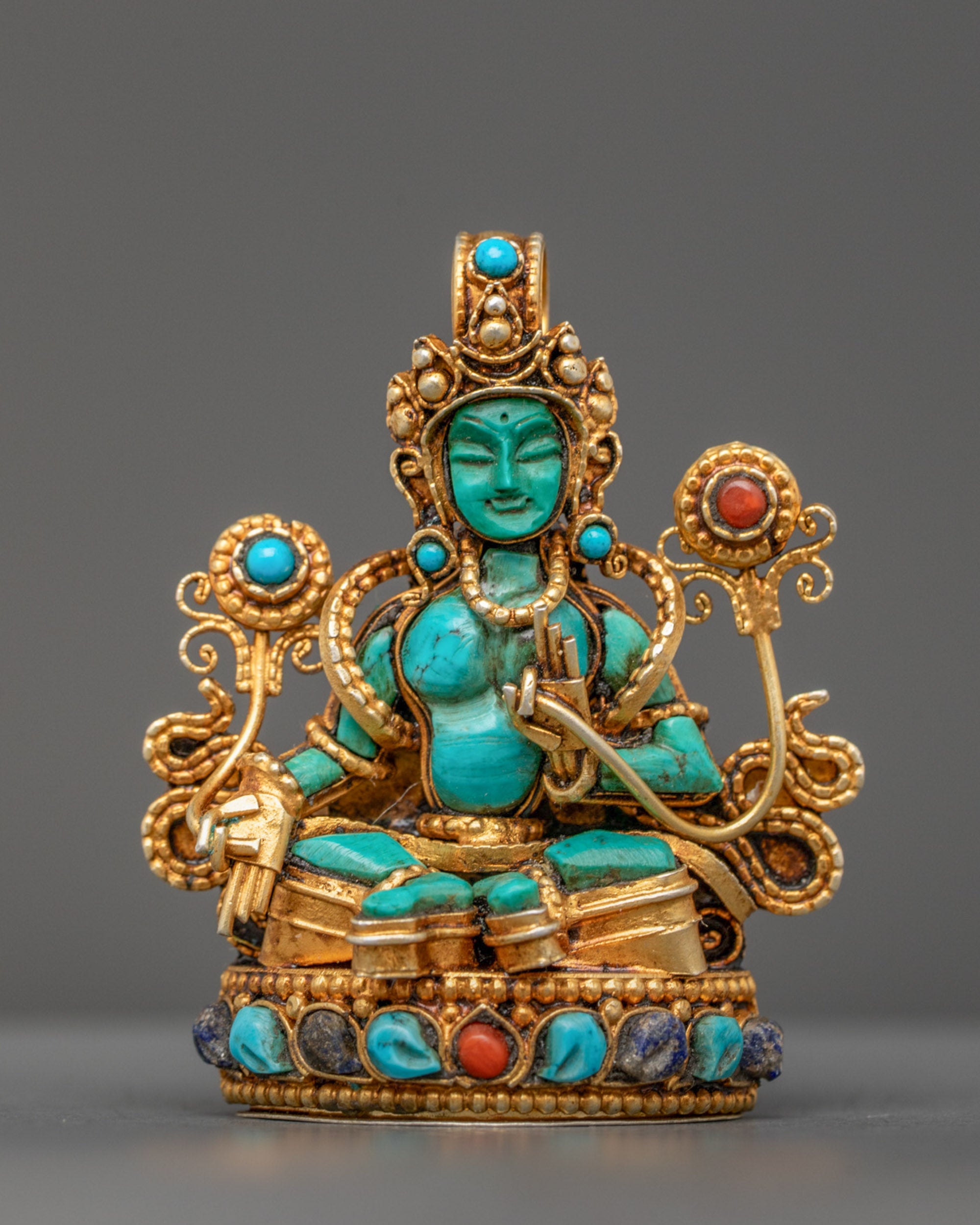 Front view of Turquoise Green Tara Pendant with utpala flower and gold-gilded filigree
