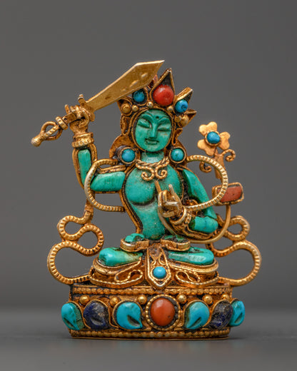 Front view of Turquoise Manjushri Locket with gold-gilded sword and lotus seat
