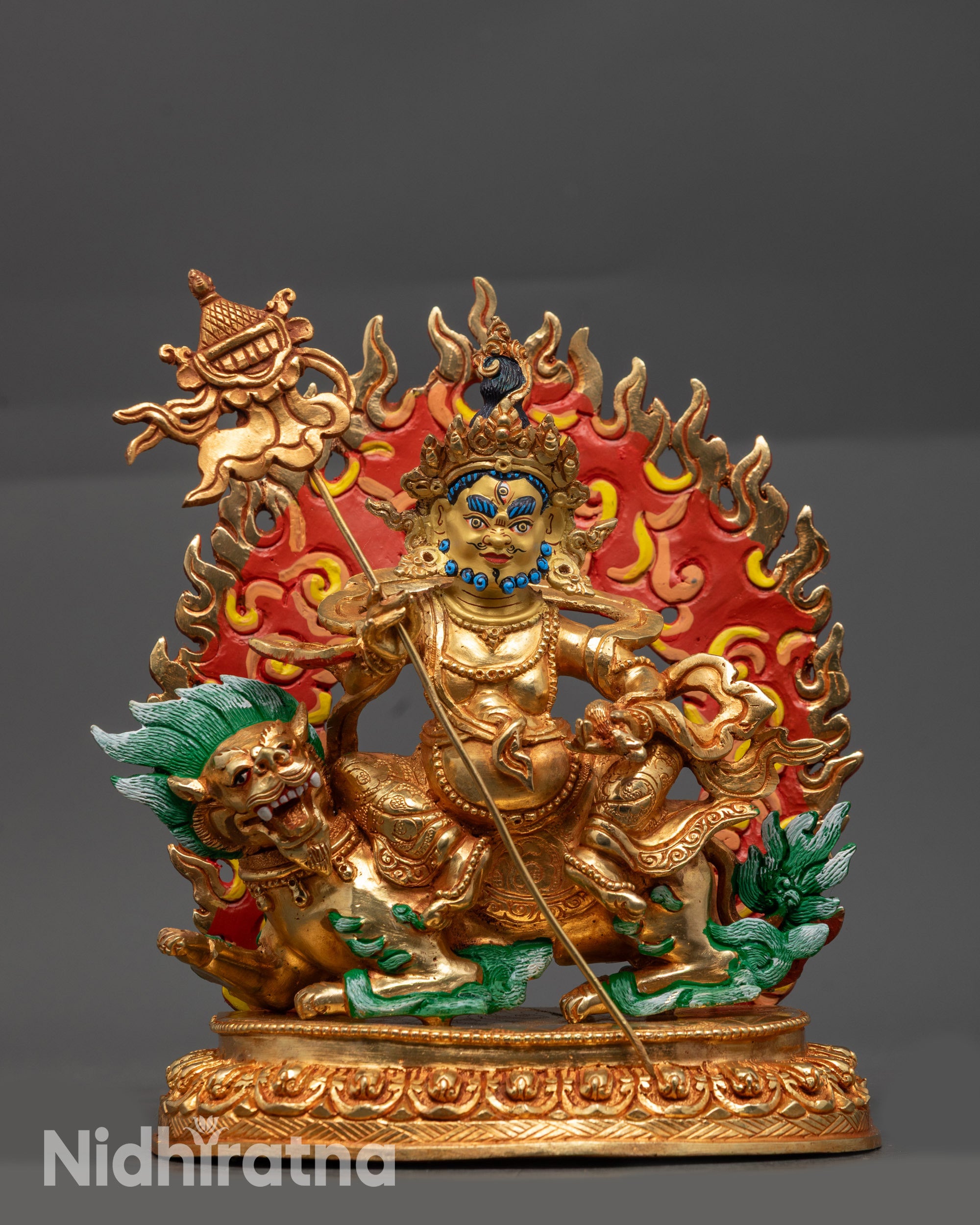 Front view of Vaishravana Namtoshe statue with gold-gilded face and fire-gilded body