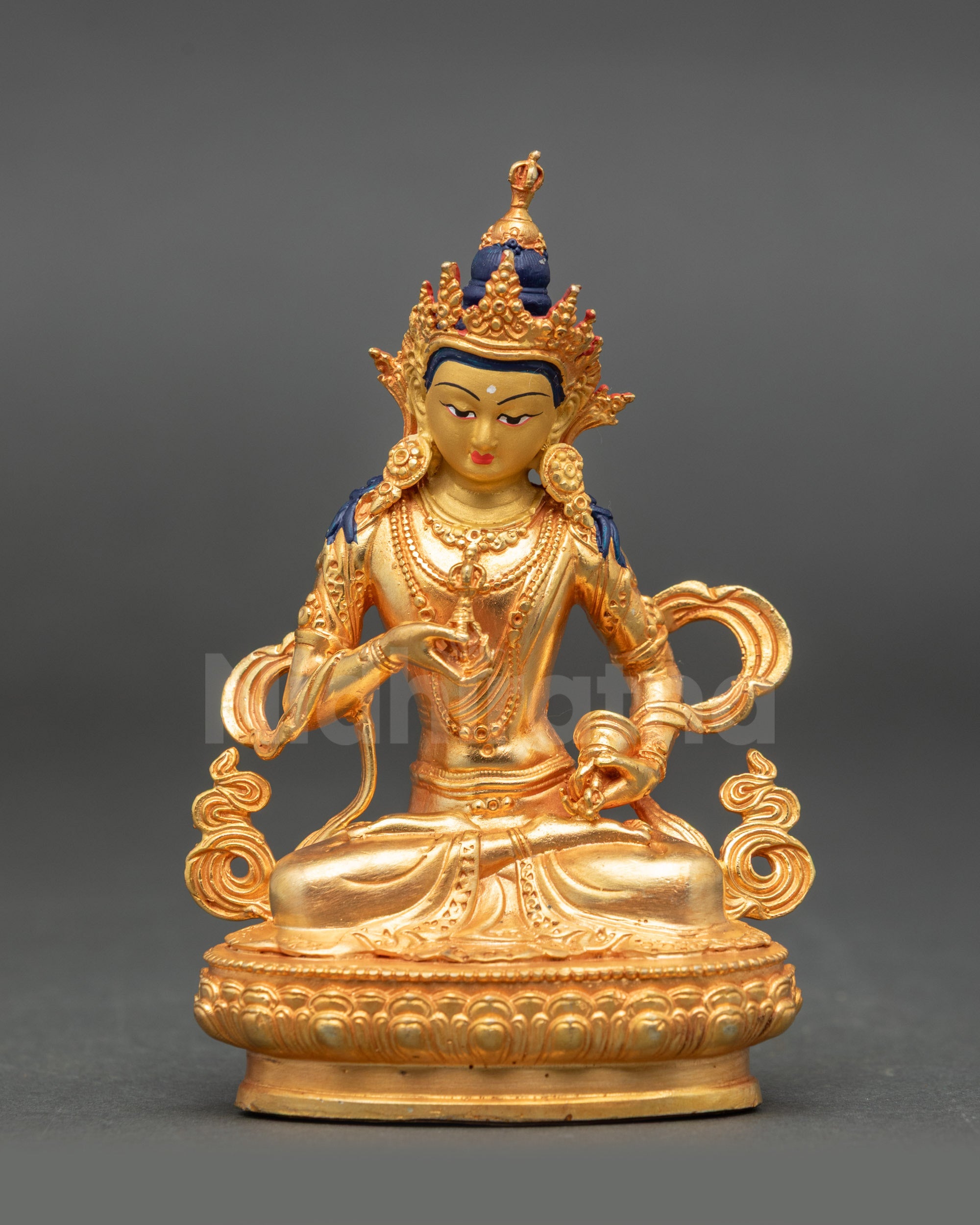 Front view of Vajrasattva Buddha holding vajra and ghanta in meditation posture