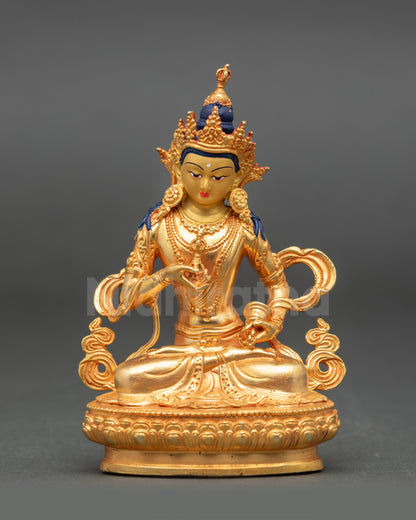 Front view of Vajrasattva Buddha holding vajra and ghanta in meditation posture