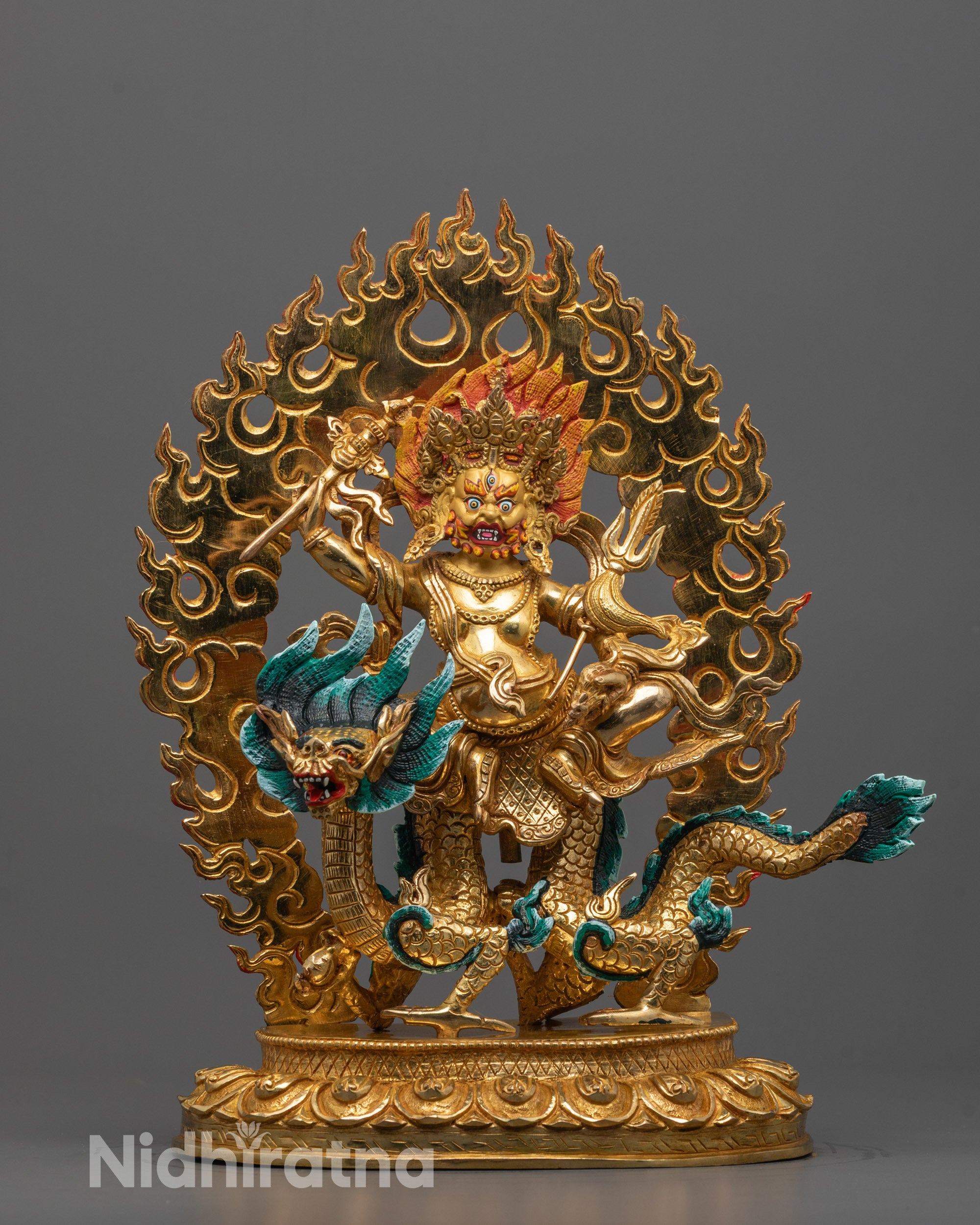 Front view of White Dzambhala Statue seated on green dragon mount with gold staff 
