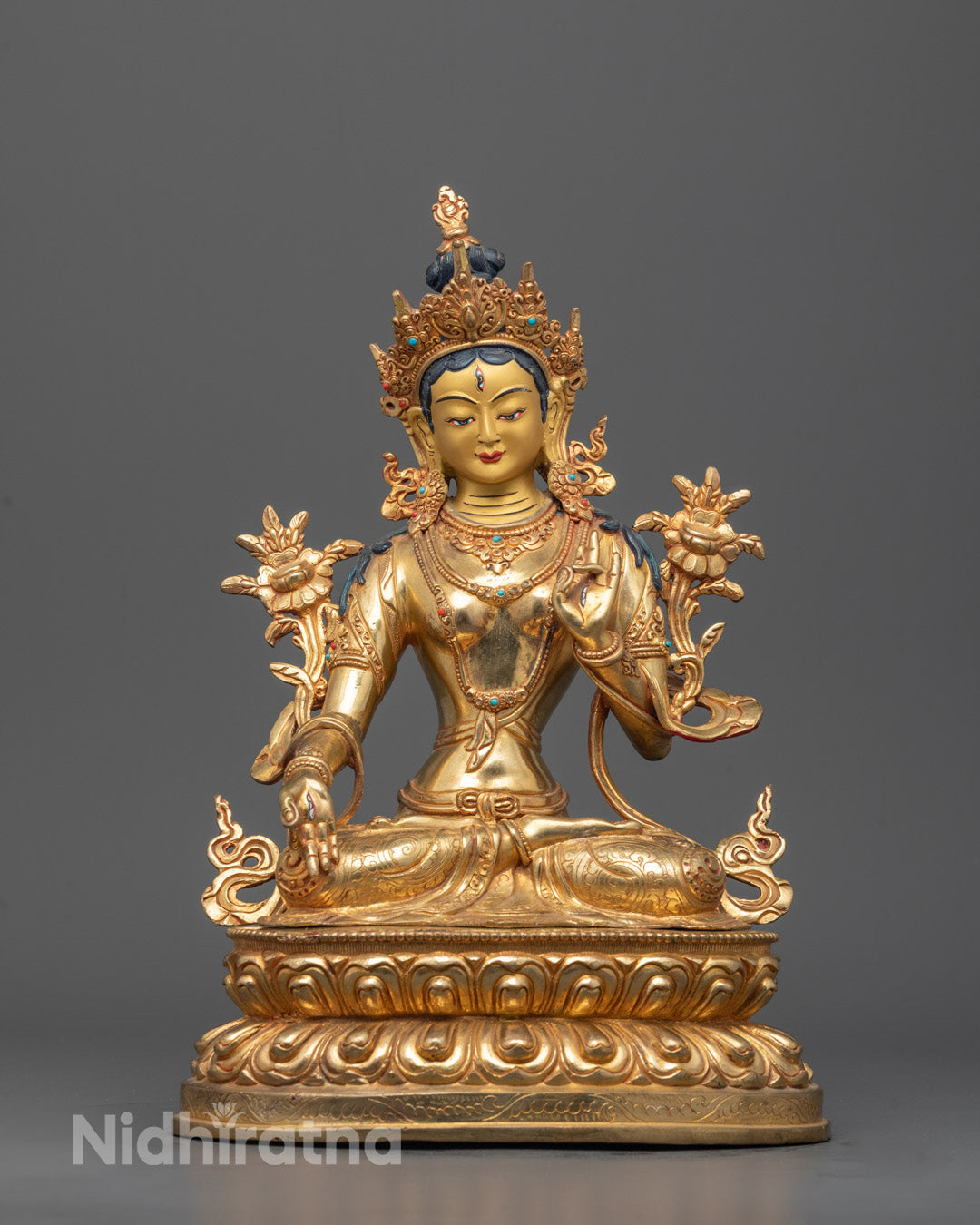 Front view of White Tara Sculpture with gold-gilded face and 7 eyes, detailed carvings
