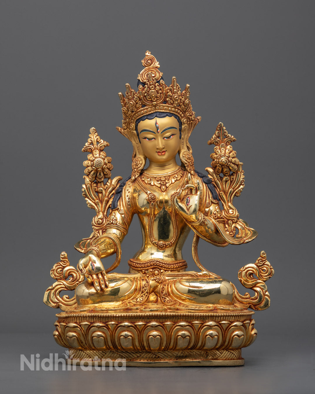 Front view of White Tara Sculpture with gold fire-gilded body and intricate carvings