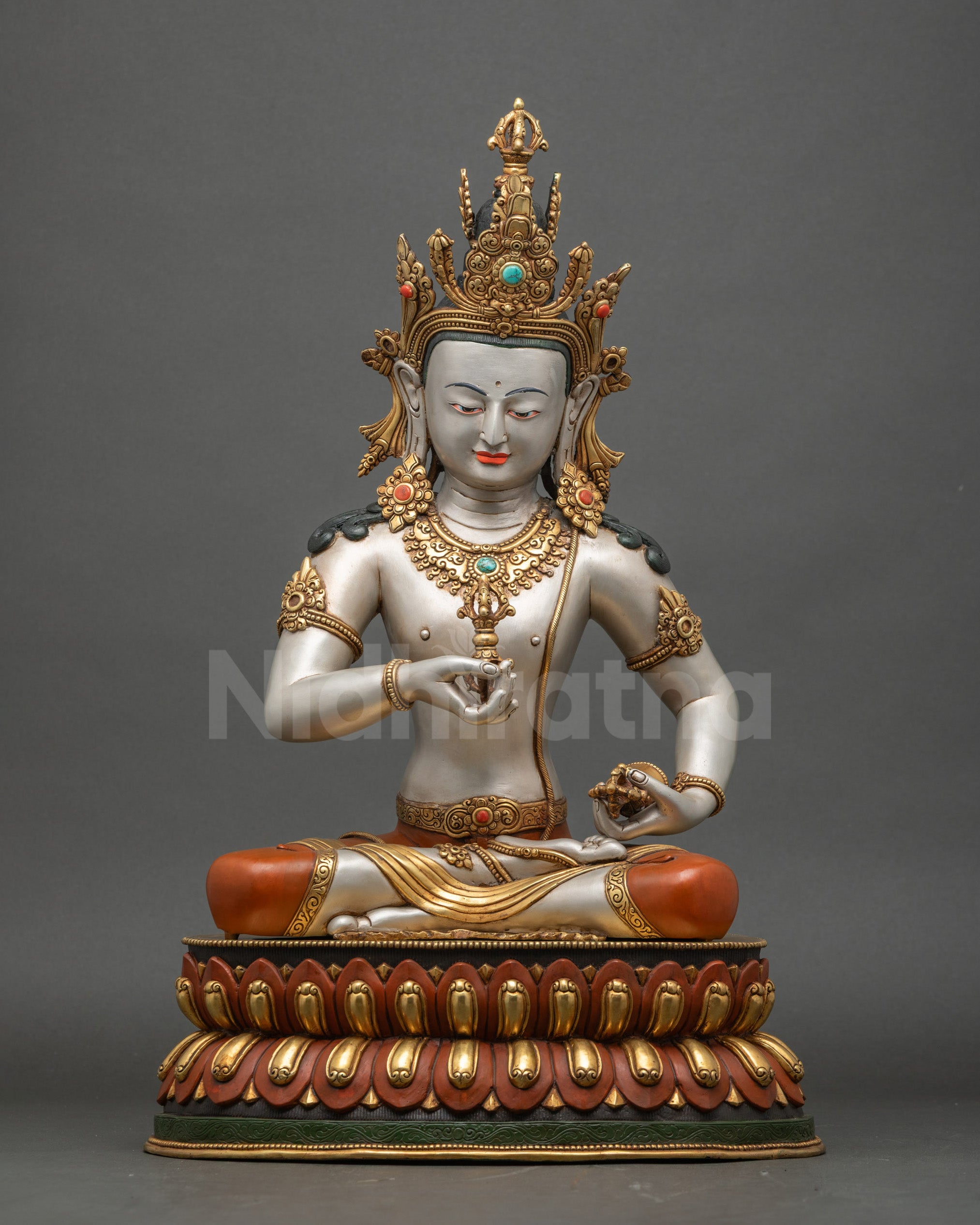 Front view of White Vajrasattva Dorje Sempa sculpture seated on double lotus with vajra and bell