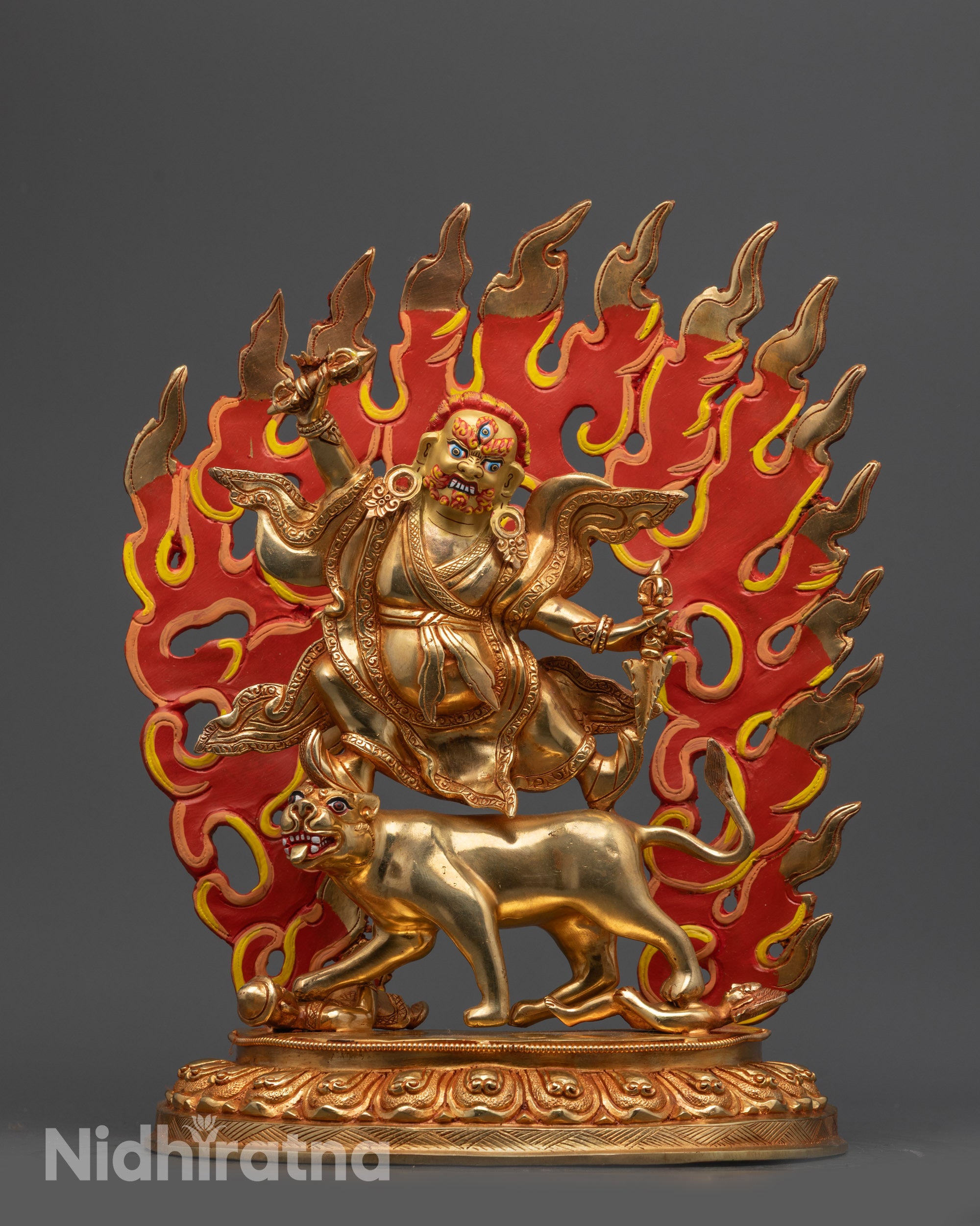 Front view of Wrathful Dorje Drolo statue standing on tigress with gold fire-gilded body