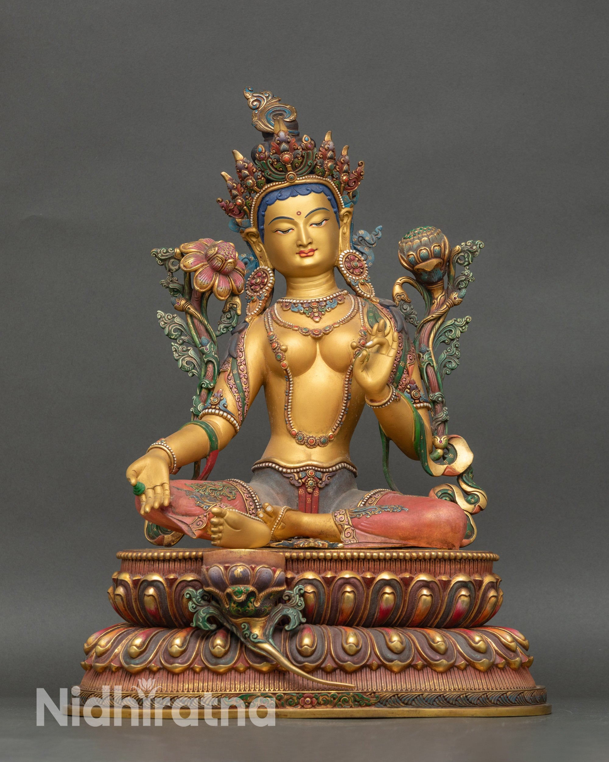 Front view of Yellow-hued Shyama Tara figurine on lotus pedestal with gold-painted face