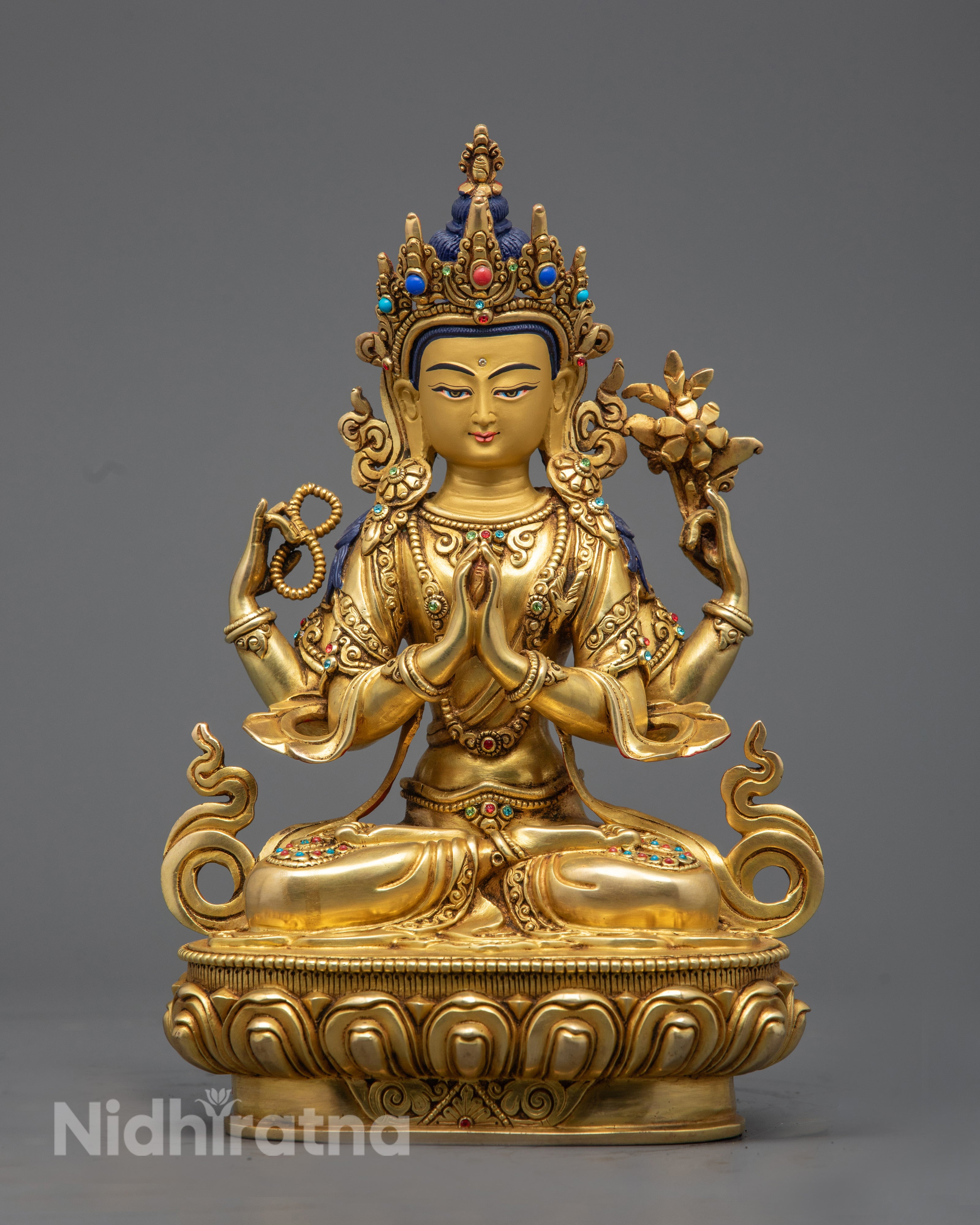 hand‑carved Chenrezig statue with 24K gold fire‑gilded body and precious stone inlaid face, seated on a lotus throne.