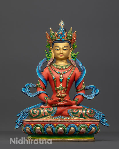 Front view of a handcrafted red Amitayus Buddha statue from Nepal on a lotus base.

