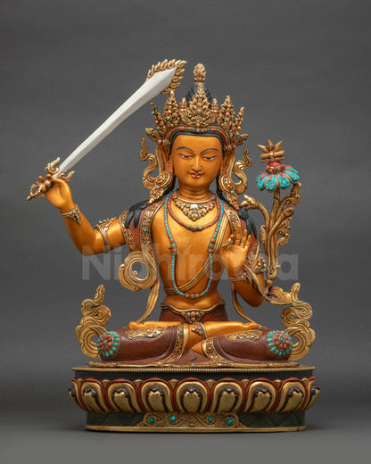 Front view of colourful handpainted Manjushri wisdom deity statue for Buddhist home altar