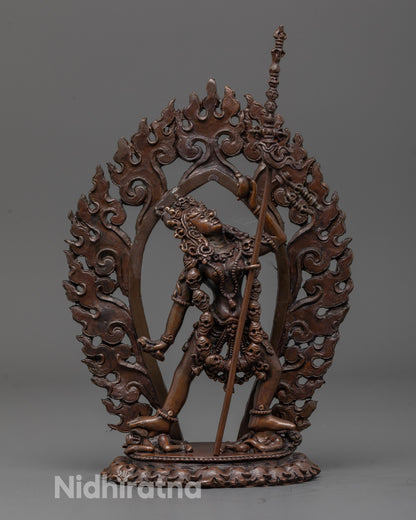 Front view of fierce Vajrayogini oxidized statue with khatvanga trident and detailed robes