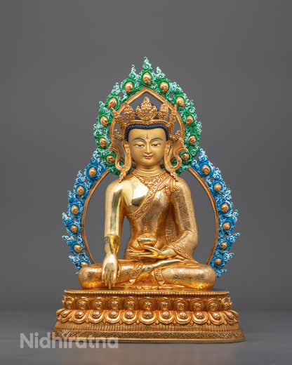 Front view of gold-gilded Bhagavan Buddha sculpture in Bhumisparsha Mudra on lotus throne