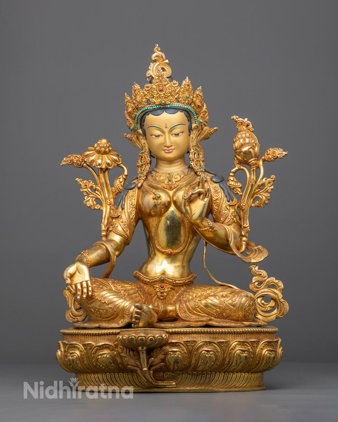 Front view of gold-gilded Mother Tara Statue on lotus throne with jeweled crown