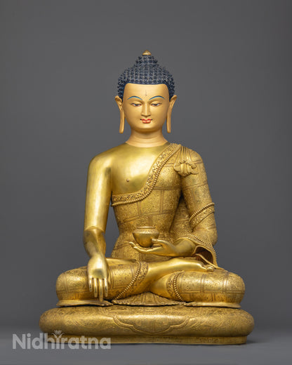 Front view of gold-gilded Shakyamuni Buddha Statue on lotus throne