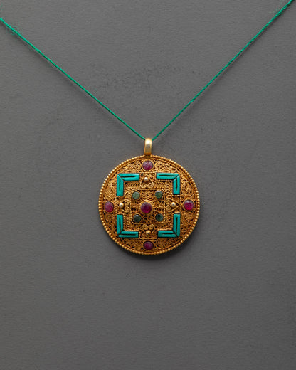 Front view of gold-plated Mandala Locket with filigree design and semi-precious stones
