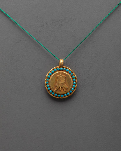 Front view of gold-plated Parasol Locket with semi-precious stones, carved by Nepal artisans