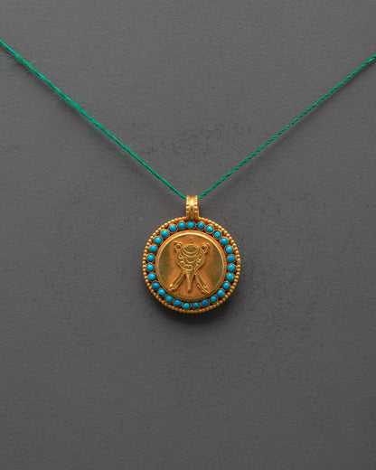 Front view of gold-plated Shell Locket with semi-precious stones, carved by Nepal artisans