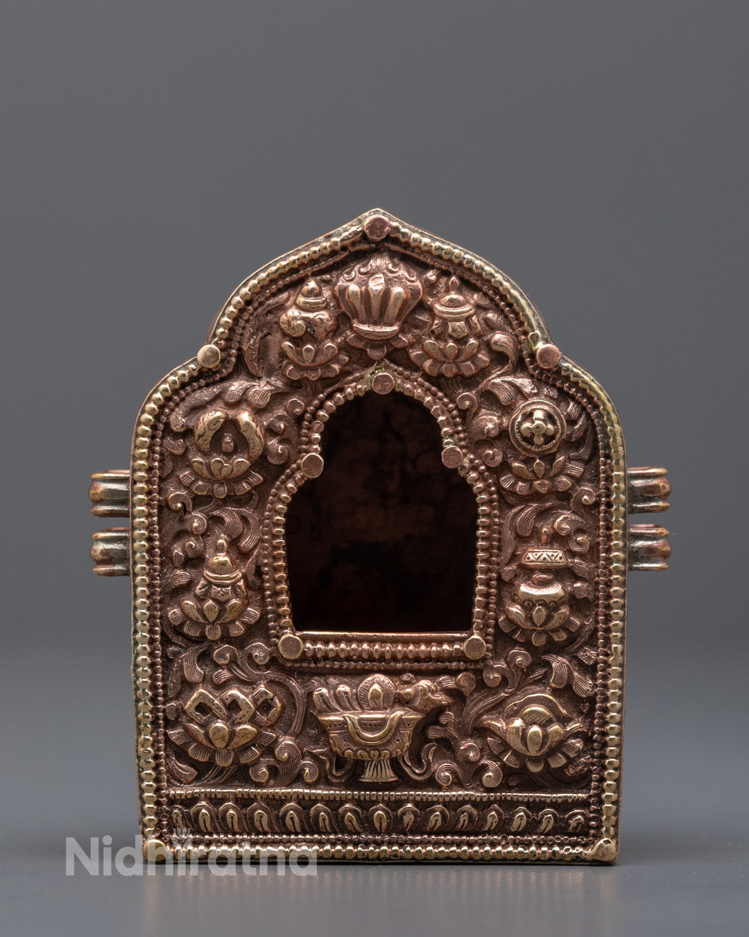 Front view of gold fire gilded Tibetan Ghau Box with hollow center for prayer scrolls