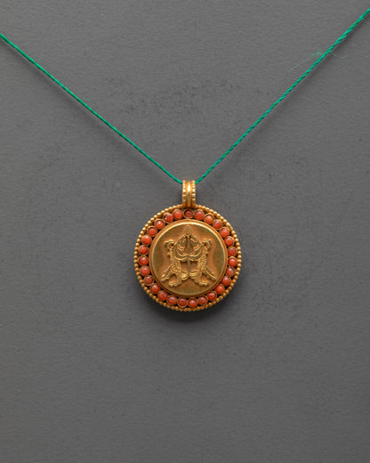 Front view of golden fish locket with gold-plated copper and semi-precious stones