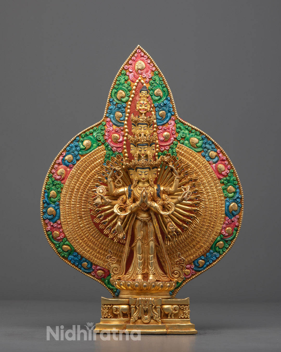 Hand-carved 1000-Armed Chenrezig Statue adorned with 24k fire-gilded gold, standing on a lotus throne – traditional Nepalese craftsmanship.