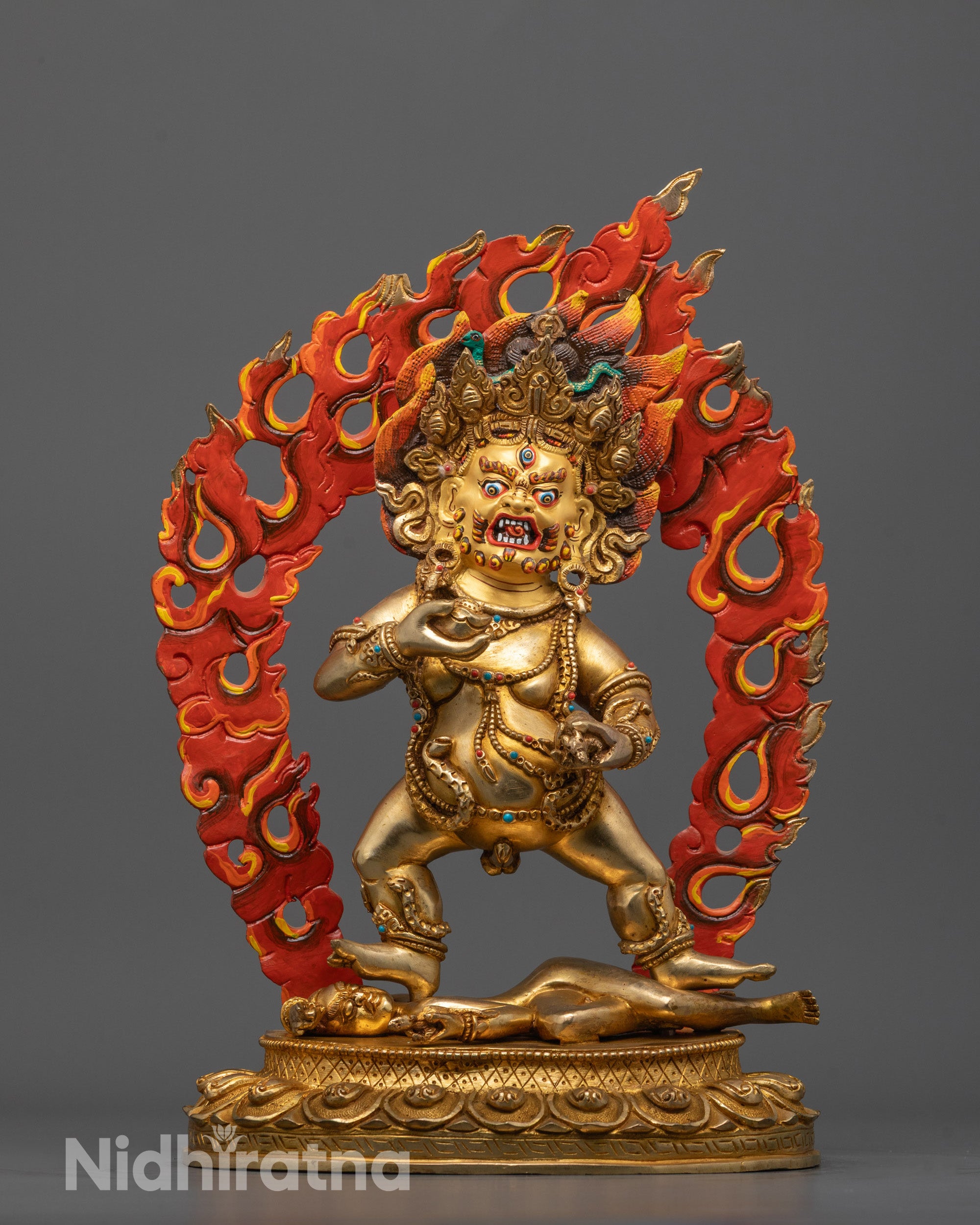 Front view of hand-carved Black Dzambhala Statue with 24k gold fire gilding standing