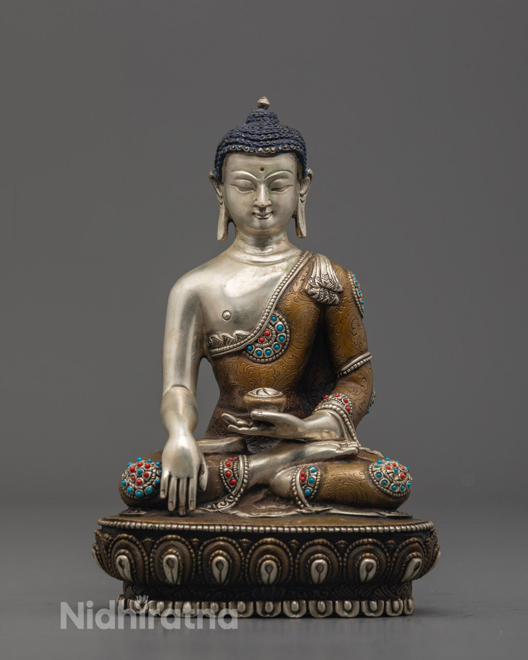hand-carved Buddha Shakyamuni Statue with oxidized copper and silver-plated body, adorned with semi-precious stones.