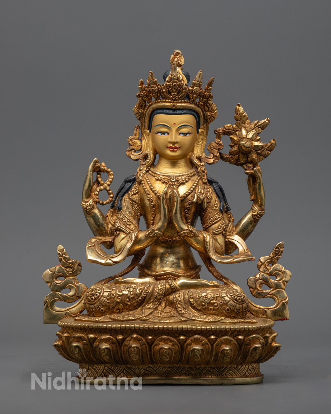 hand-carved Chenrezig Statue gilded in 24k gold with vibrant acrylic detailing – traditional Tibetan Buddhist art from Nepal