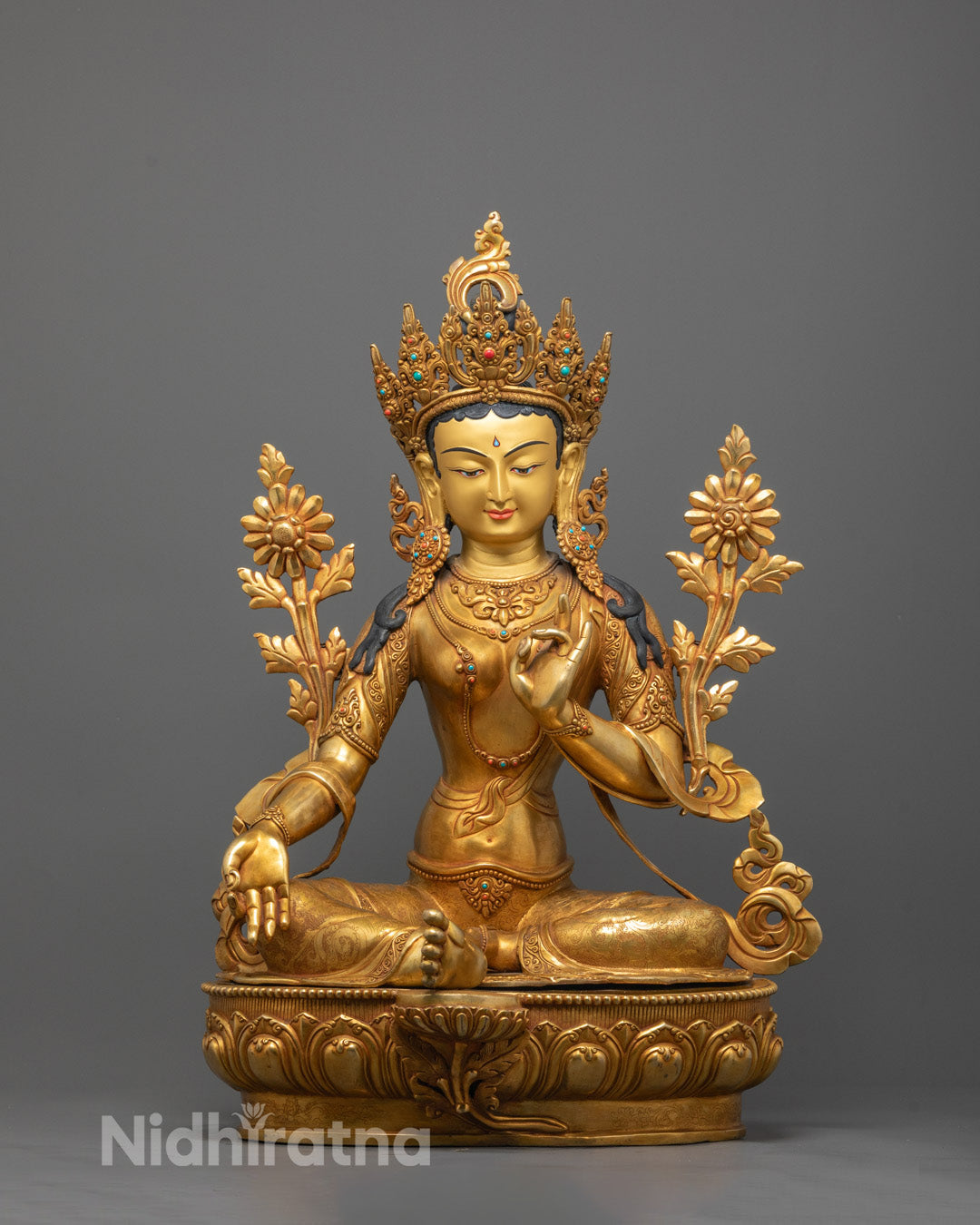 Front view of hand-carved Green Tara Statue seated on lotus base