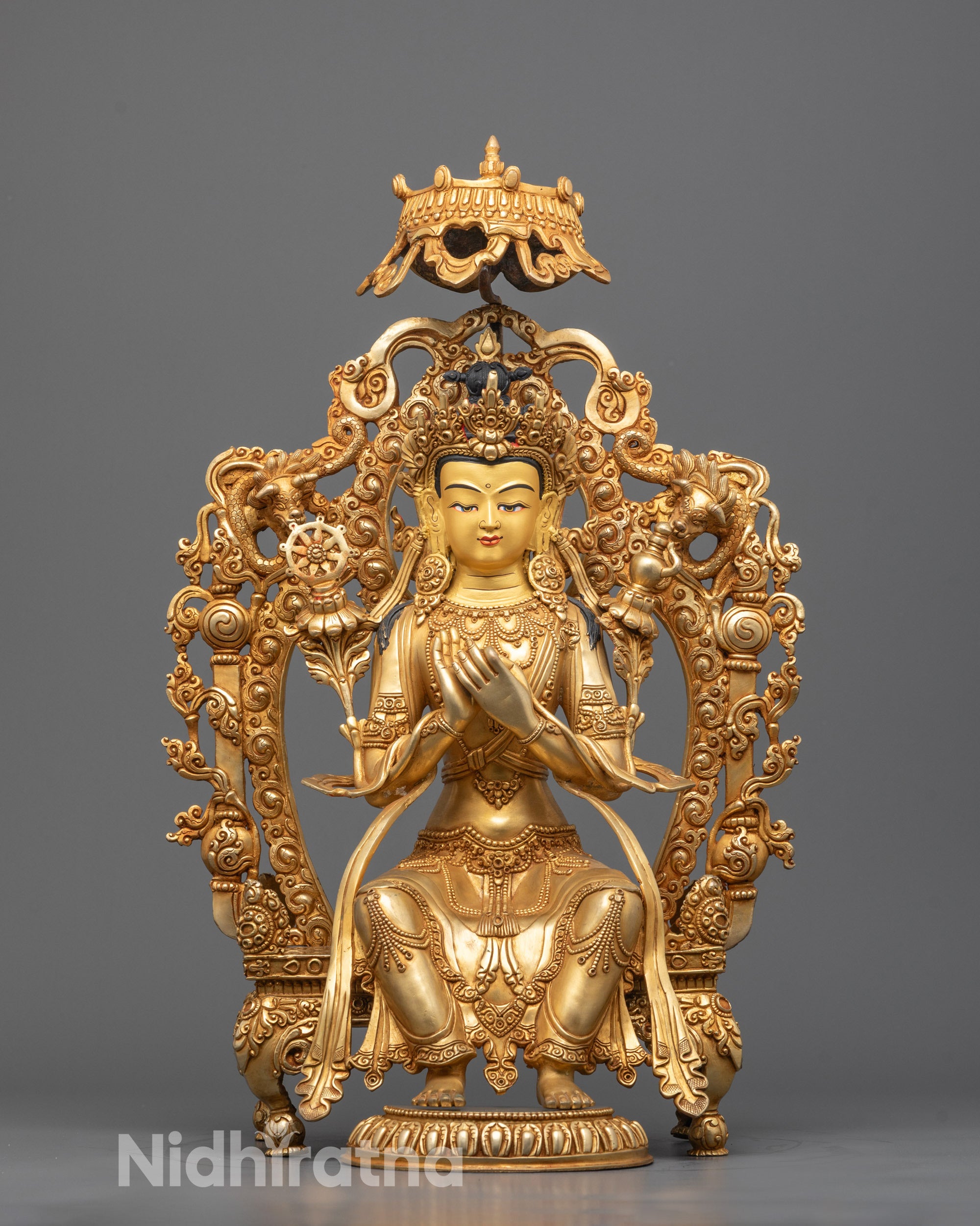 Front view of hand-carved Maitreya Buddha Statue seated on a detailed throne