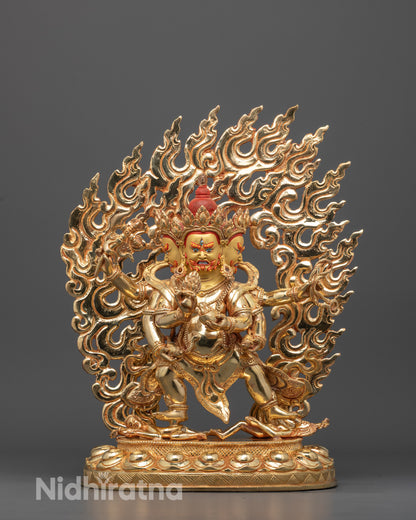 Front view of hand-carved Red Dzambhala statue with three heads and six arms