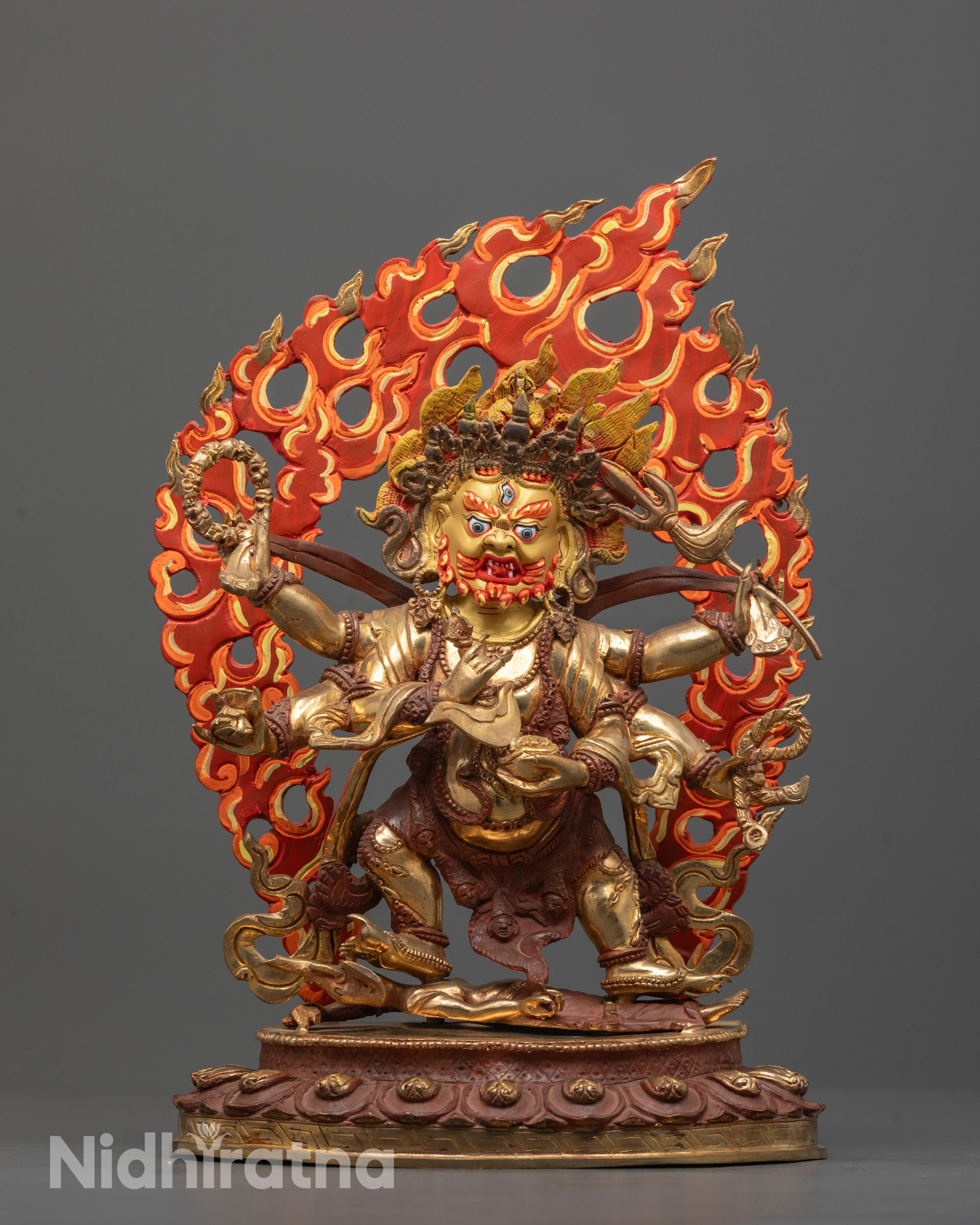 Front view of hand-carved Six-Armed Mahakala statue standing on lotus base