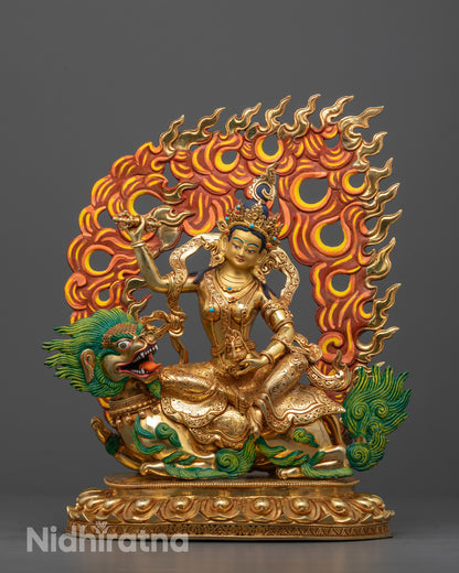 Front view of hand-carved Tsheringma statue seated on a white snow lion with neon mane
