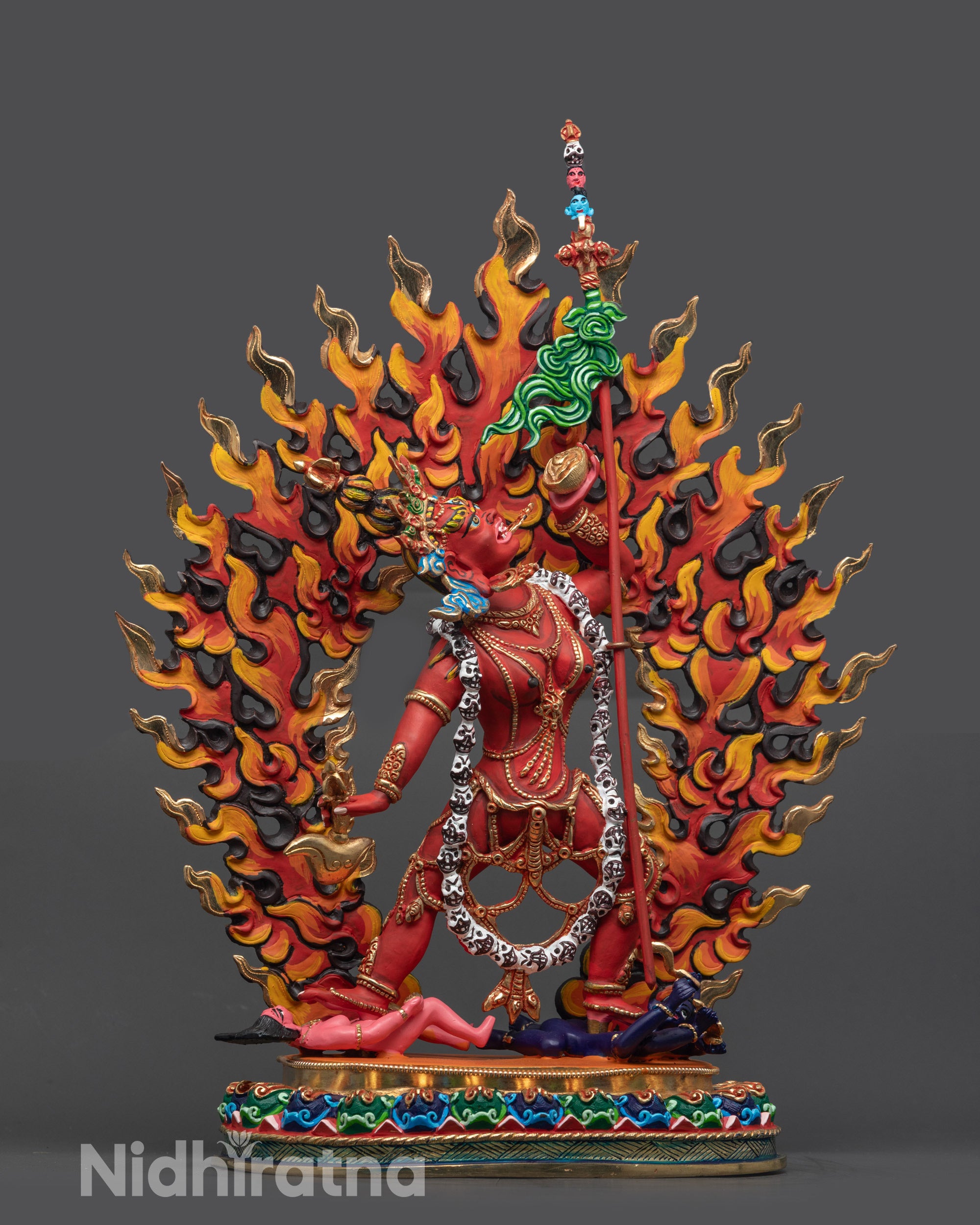 Front view of hand-carved Vajrayogini statue with red acrylic and five-skull crown