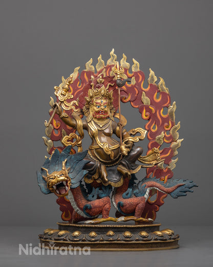 Front view of hand-carved White Dzambhala statue with gold-gilded face and colored halo