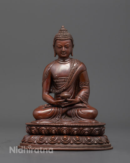 Front view of handcrafted Amitabha Buddha sculpture in oxidized copper, seated on a lotus base