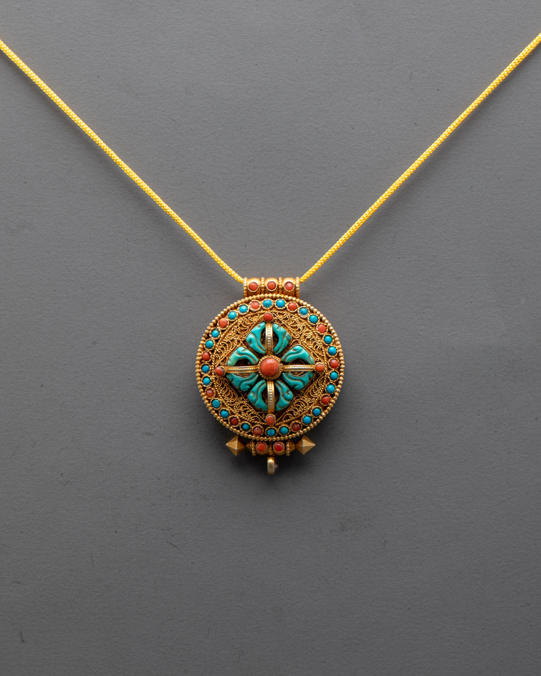 Front view of handcrafted Bishwo Vajra Locket made from copper